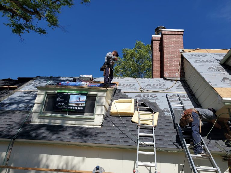 2 roofers inspecting for roof maintenance